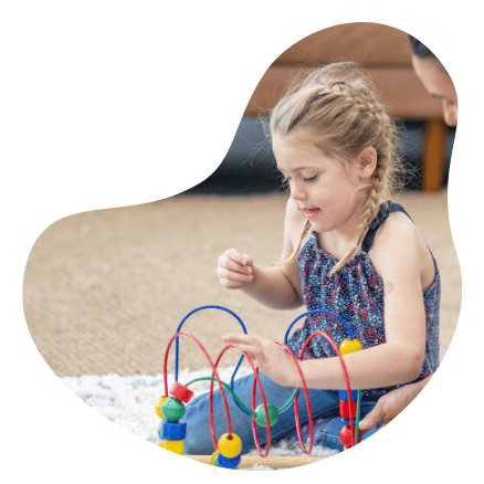 cot-ab-h2 young blonde girl working on puzzle at kids OT session