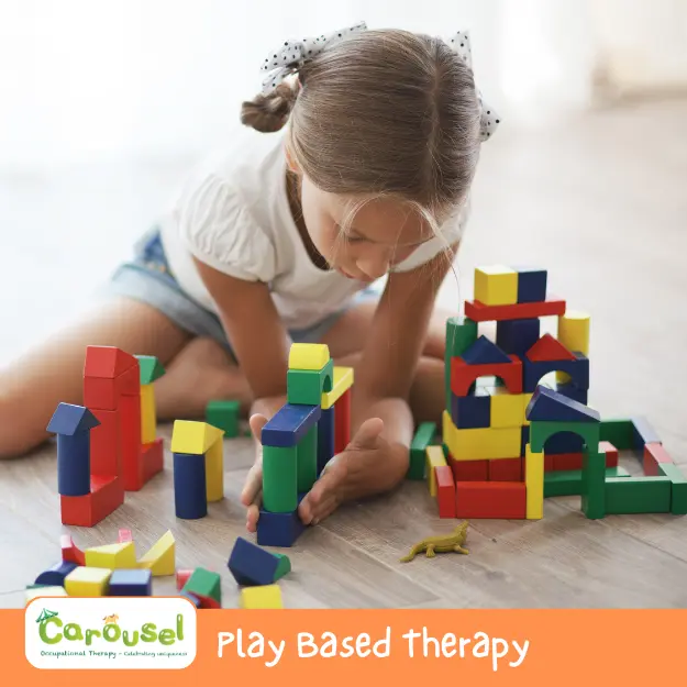 cot-ser1 young girl playing with blocks